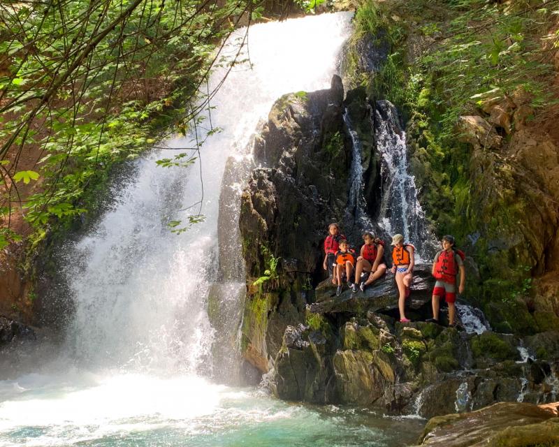 Peak Adventures summer camp near waterfall.